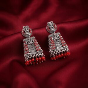 oxidised silver-tone jhumka earrings with Lakshmi motif top and green bead drops