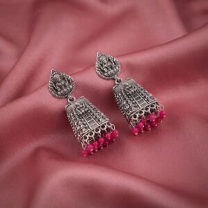 oxidised silver-tone temple jhumka earrings with Lakshmi motif top and maroon bead drops