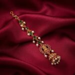 gold-tone maang tikka with jhumka drop, pearl-style beads and stone-style teardrops