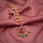 Pink and green gold-tone maang tikka